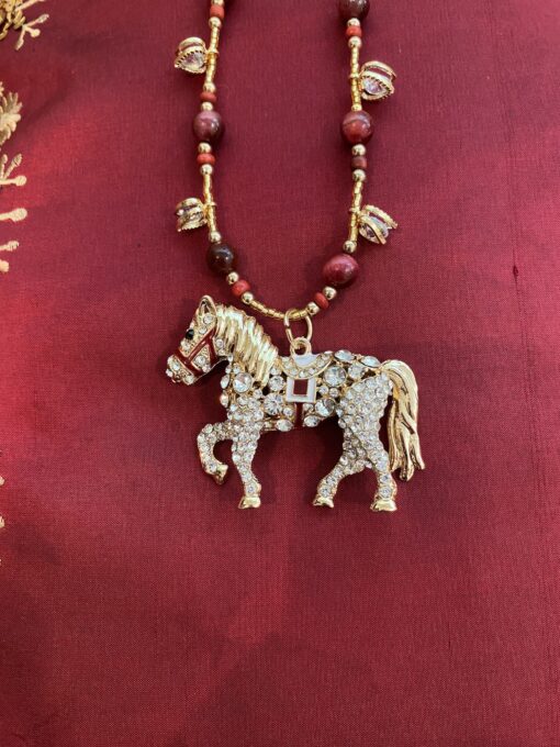 Gold horse with red garnet and crystals necklace